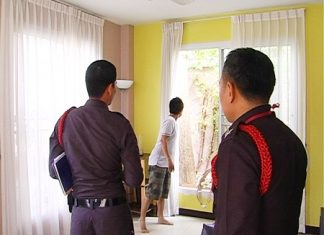 Police examine the suspected entry and exit point of the burglars.